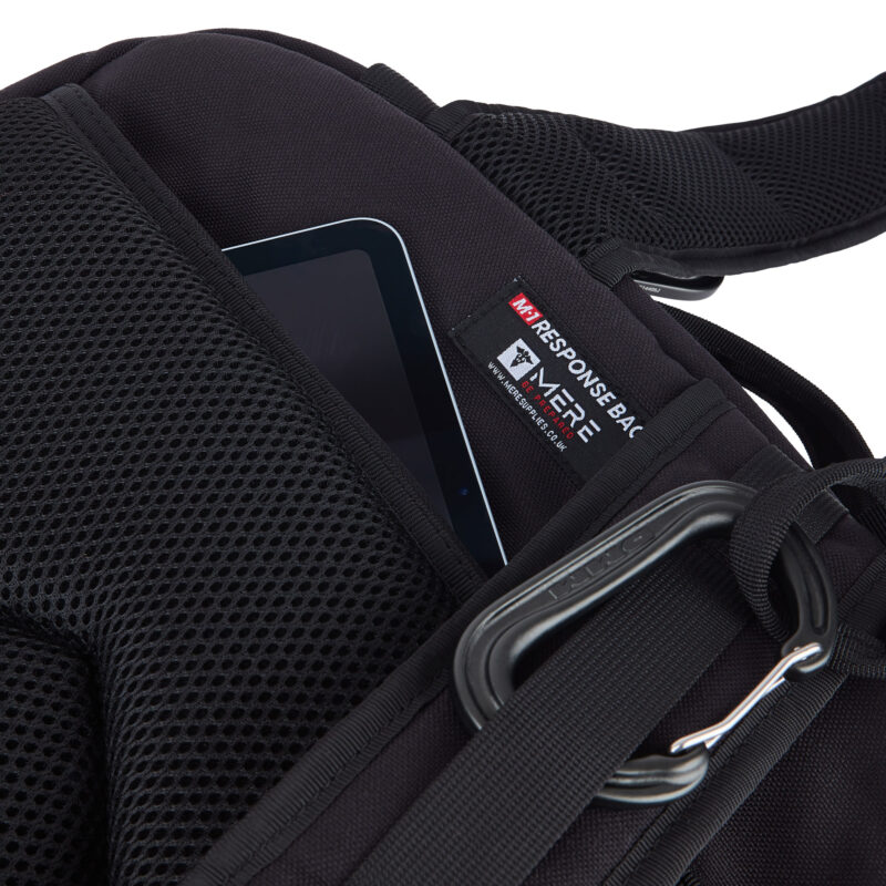 showing the mere m1 response bag tag also showing there is a compartment for an ipad, tablet or laptop